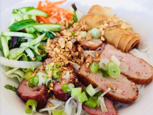 67.  Grilled pork patties over vermicelli