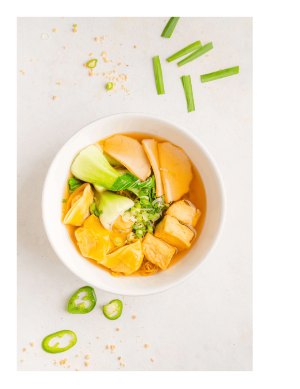 Clam soup in a black bowl